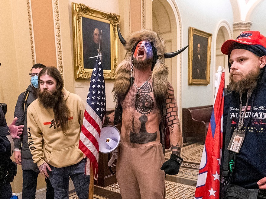  Lawyer for ‘QAnon shaman’ says plea deal being ‘earnestly’ mentioned